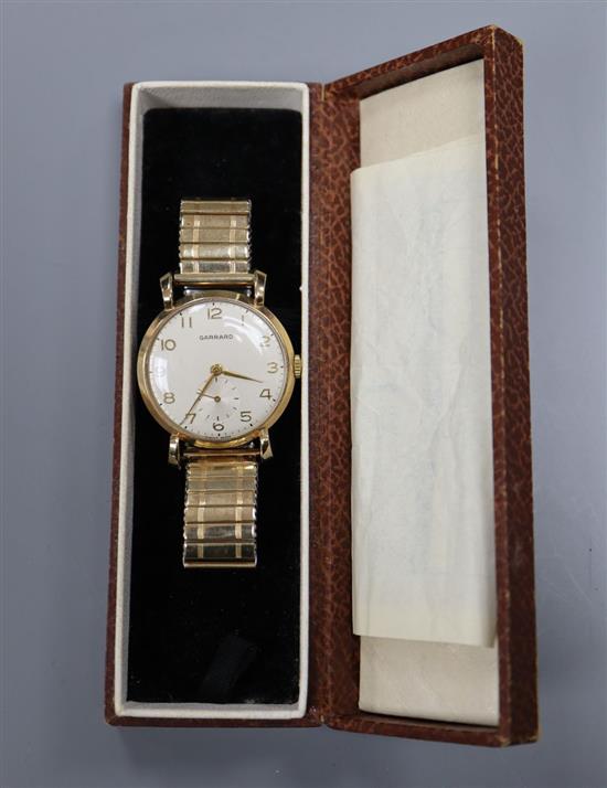 A Garrard 9ct gold-cased presentation wristwatch, with cream Arabic dial and subsidiary seconds, on expanding metal bracelet